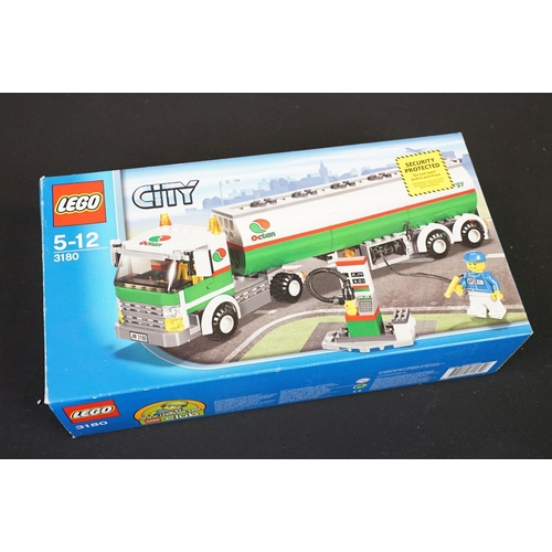 293 - Collection of various toys to include 2 x boxed Lego City sets to include 3180 and 3221 (Both built,... 