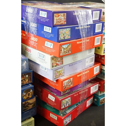 300 - Collection of 100 boxed jigsaw puzzles to include examples from Waddingtons featuring mainly 1000, 1... 