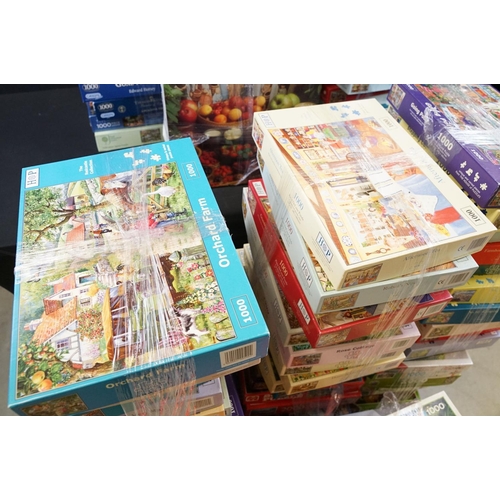 300 - Collection of 100 boxed jigsaw puzzles to include examples from Waddingtons featuring mainly 1000, 1... 