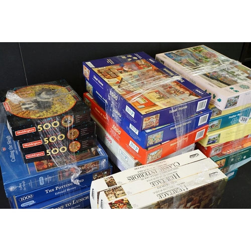 300 - Collection of 100 boxed jigsaw puzzles to include examples from Waddingtons featuring mainly 1000, 1... 