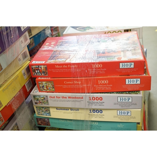 300 - Collection of 100 boxed jigsaw puzzles to include examples from Waddingtons featuring mainly 1000, 1... 