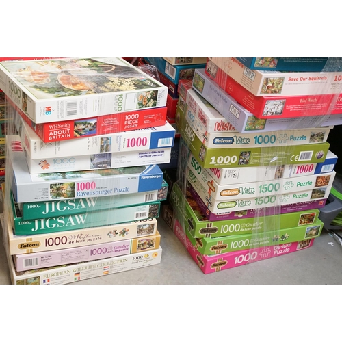 300 - Collection of 100 boxed jigsaw puzzles to include examples from Waddingtons featuring mainly 1000, 1... 