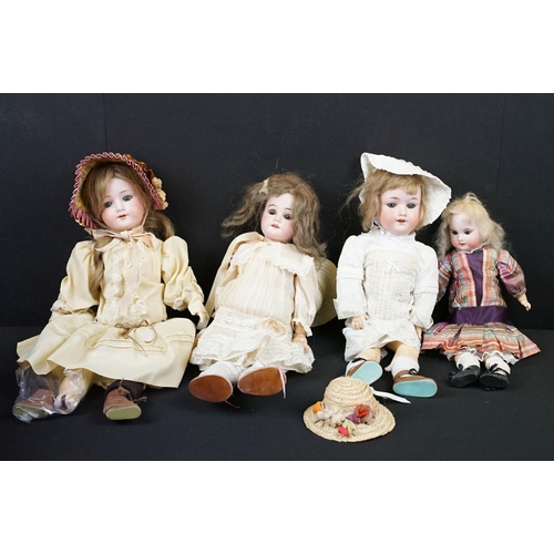 346 - Four Armand Marseille bisque headed dolls in the form of girls. Three having sleeping eyes and teeth... 