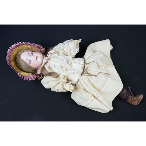 346 - Four Armand Marseille bisque headed dolls in the form of girls. Three having sleeping eyes and teeth... 