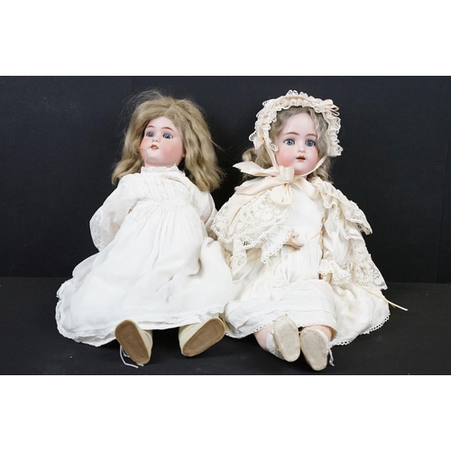 347 - Two early 20th Century bisque headed dolls both with sleeping eyes, teeth and hand painted details. ... 