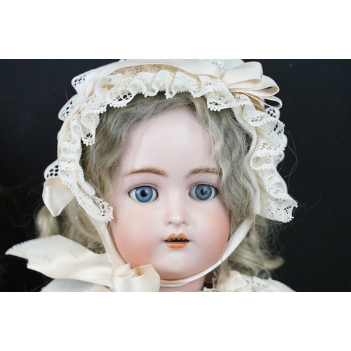 347 - Two early 20th Century bisque headed dolls both with sleeping eyes, teeth and hand painted details. ... 