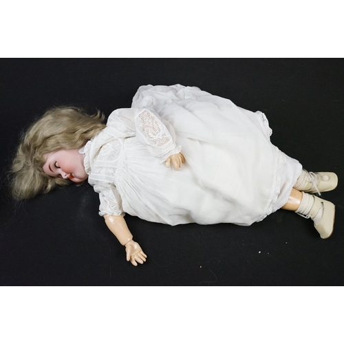 347 - Two early 20th Century bisque headed dolls both with sleeping eyes, teeth and hand painted details. ... 