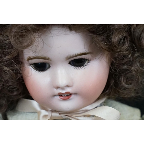 348 - Three Late 19th / early 20th Century bisque headed dolls all having teeth and one with sleeping eyes... 