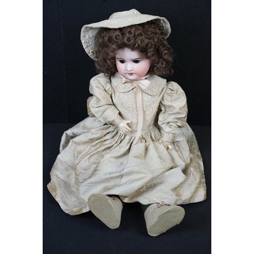 348 - Three Late 19th / early 20th Century bisque headed dolls all having teeth and one with sleeping eyes... 