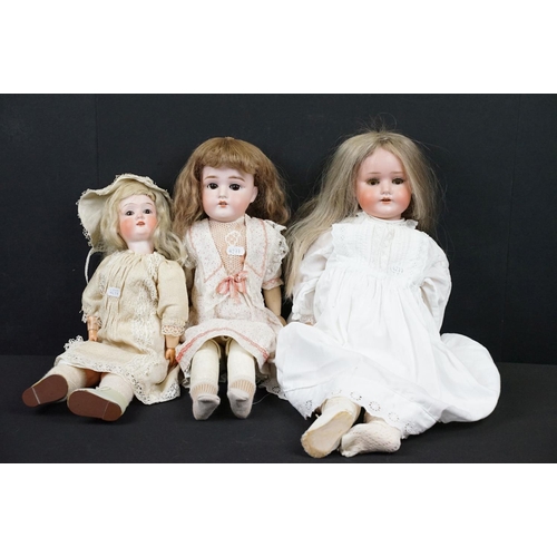 349 - Three late 19th / early 20th Century porcelain headed child dolls, two having sleeping eyes, all wit... 