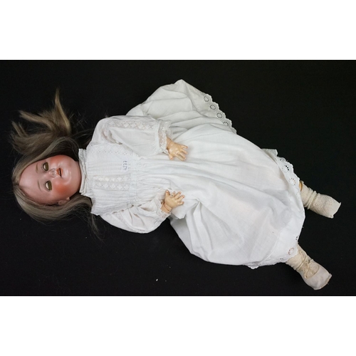 349 - Three late 19th / early 20th Century porcelain headed child dolls, two having sleeping eyes, all wit... 