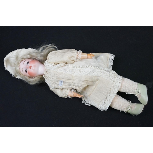 349 - Three late 19th / early 20th Century porcelain headed child dolls, two having sleeping eyes, all wit... 