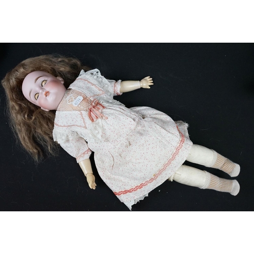 349 - Three late 19th / early 20th Century porcelain headed child dolls, two having sleeping eyes, all wit... 