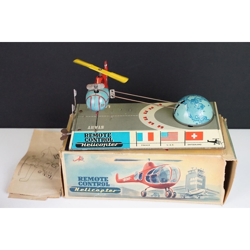 356 - Two boxed mid 20th C tin plate toys to include Sulky (Brevetti  Boroli Bologna, Italy) horse with jo... 