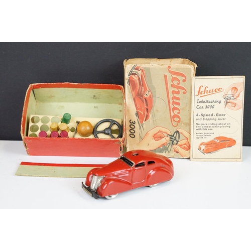 359 - Boxed Schuco clockwork tin plate Telesteering Car 3000 in red with accessories and instructions, mis... 