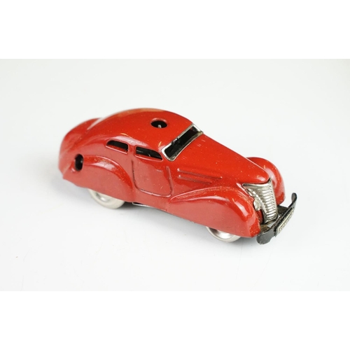 359 - Boxed Schuco clockwork tin plate Telesteering Car 3000 in red with accessories and instructions, mis... 