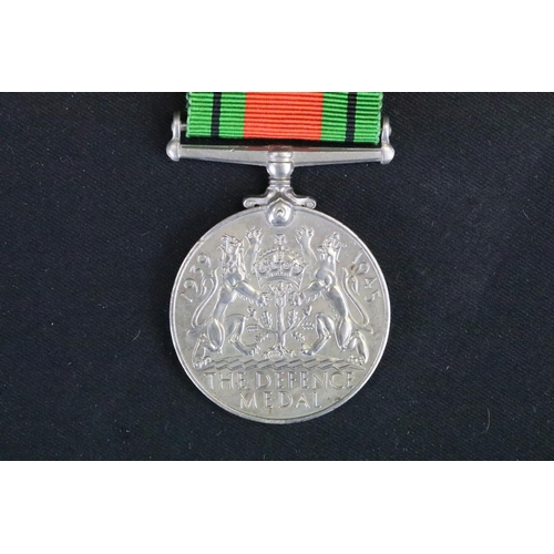 13 - A British Full Size World War Two Medal Trio To Include The 1939-1945 British War Medal, The Defence... 