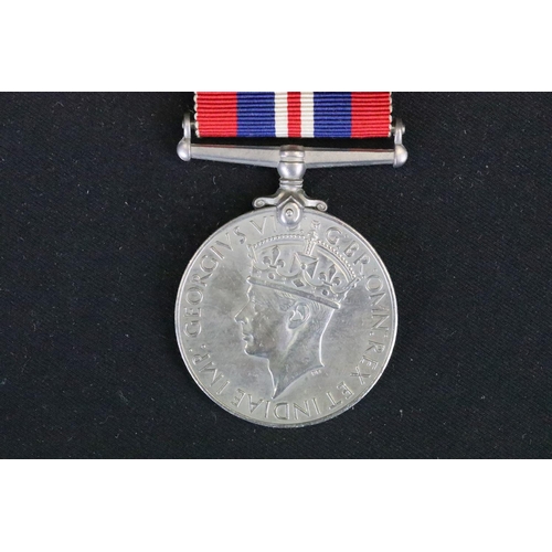 13 - A British Full Size World War Two Medal Trio To Include The 1939-1945 British War Medal, The Defence... 