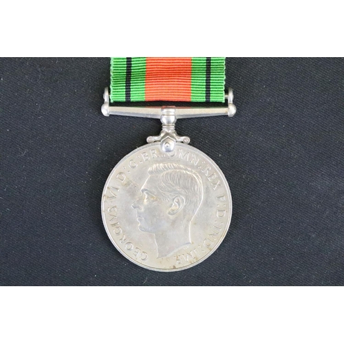 13 - A British Full Size World War Two Medal Trio To Include The 1939-1945 British War Medal, The Defence... 