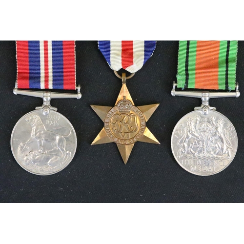 14 - A British Full Size World War Two Medal Trio To Include The 1939-1945 British War Medal, The Defence... 