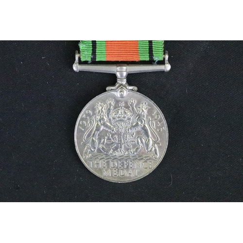 14 - A British Full Size World War Two Medal Trio To Include The 1939-1945 British War Medal, The Defence... 