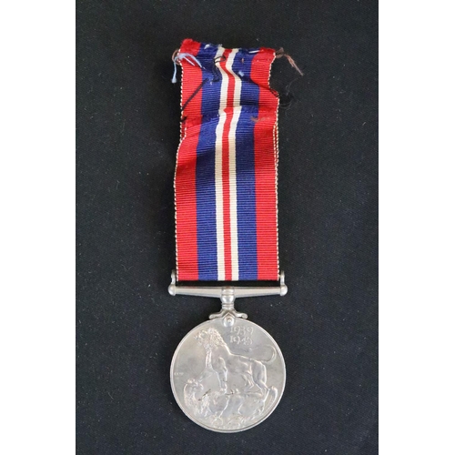 14 - A British Full Size World War Two Medal Trio To Include The 1939-1945 British War Medal, The Defence... 