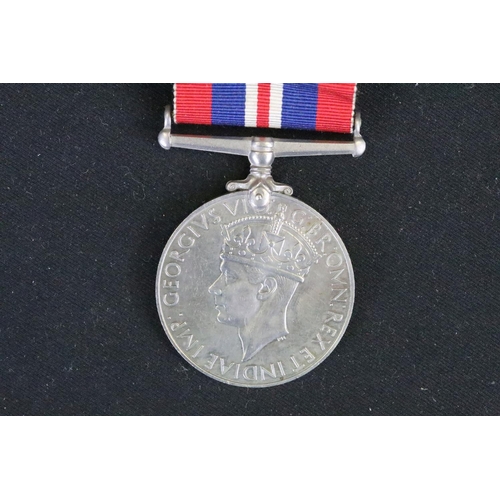 14 - A British Full Size World War Two Medal Trio To Include The 1939-1945 British War Medal, The Defence... 