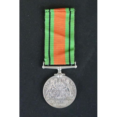 14 - A British Full Size World War Two Medal Trio To Include The 1939-1945 British War Medal, The Defence... 