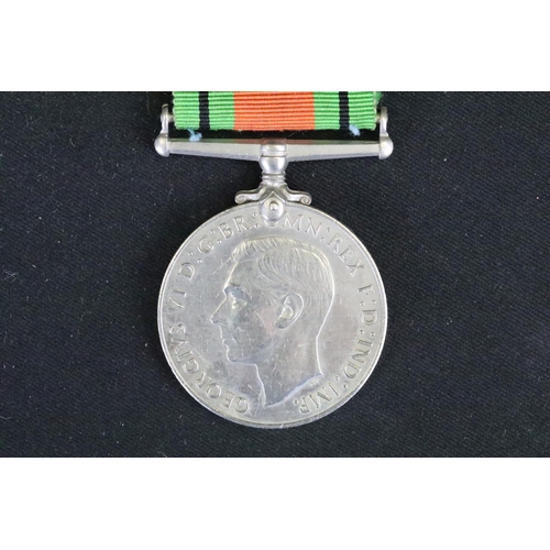 14 - A British Full Size World War Two Medal Trio To Include The 1939-1945 British War Medal, The Defence... 