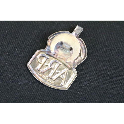 5 - A small group of British World War Two era badges to include silver examples.