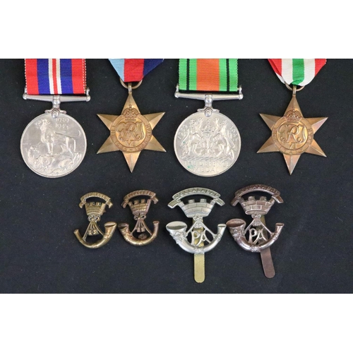 7 - A British full size World War Two medal group to include The 1939-45 British war medal, the Defence ... 