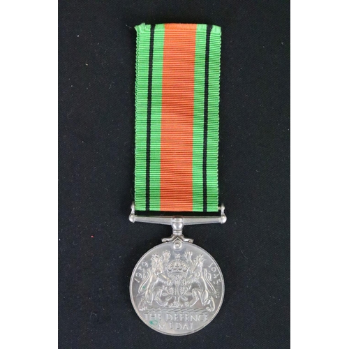 7 - A British full size World War Two medal group to include The 1939-45 British war medal, the Defence ... 