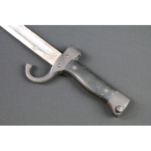 103 - A military hooked quillion bayonet complete with scabbard and frog.