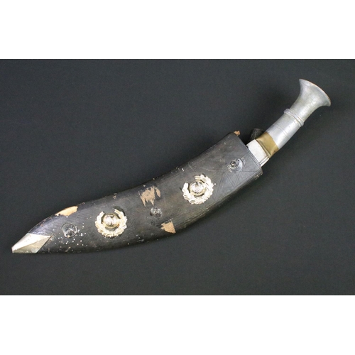 104 - A vintage Gurkha Kukri knife complete with scabbard adorned with two Royal Marines badges.