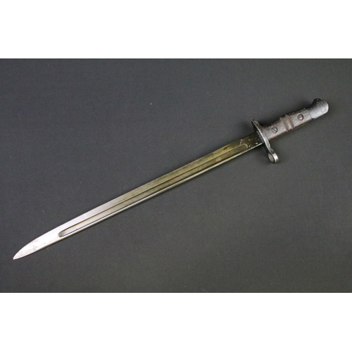 112 - A World War One 1913 pattern bayonet complete with original leather scabbard.