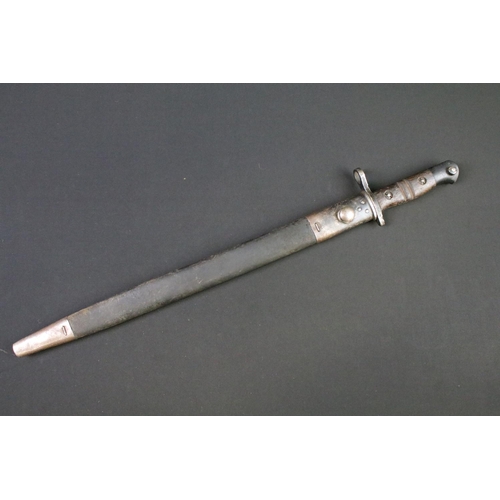 112 - A World War One 1913 pattern bayonet complete with original leather scabbard.