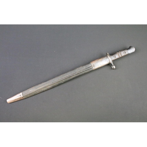 112 - A World War One 1913 pattern bayonet complete with original leather scabbard.