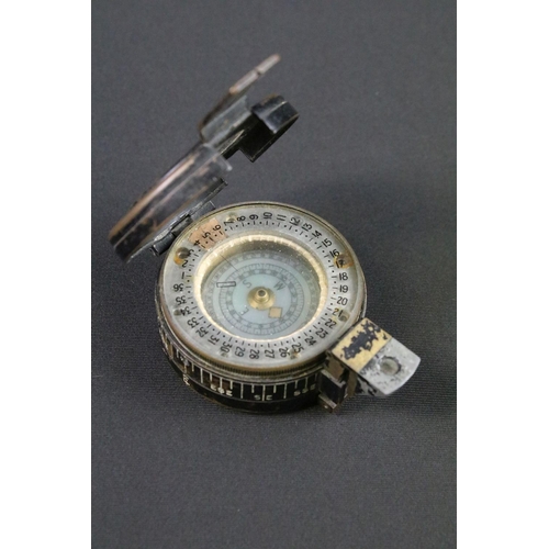 113 - A British World War Two MK.3 marching compass, maker marked for T.G. & Co, dated 1939 and marked wit... 