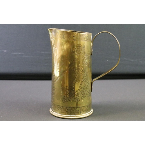 119 - A World War One Trench Art jug made from a spent artillery shell, etched  decoration to the Army Ser... 