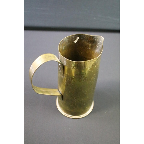 119 - A World War One Trench Art jug made from a spent artillery shell, etched  decoration to the Army Ser... 