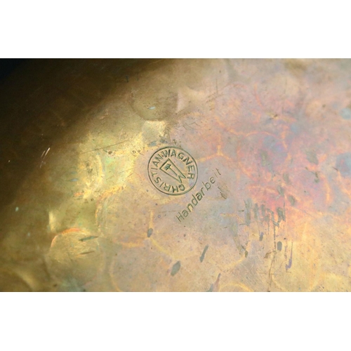 125 - A vintage hammered copper dish badged to the Kenya Regiment together with a quantity of military clo... 