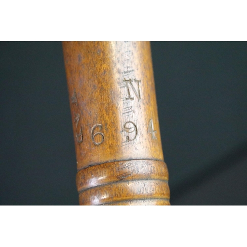 128 - A British World war Two War Department issued wooden truncheon, marked WD together with the broad ar... 