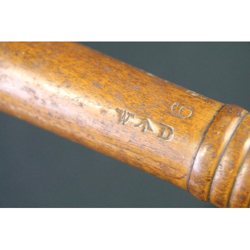 128 - A British World war Two War Department issued wooden truncheon, marked WD together with the broad ar... 