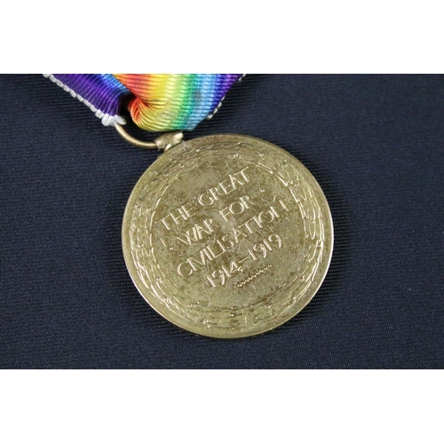 98 - A British full size World War One medal group of three to include the Victory Medal, the 1914-1918 B... 