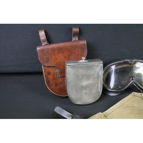 120 - A group of mixed militaria to include a World War One folding trench saw, sandwich case within leath... 