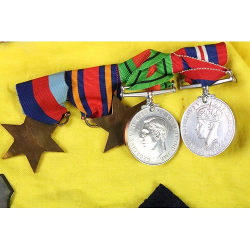 147 - Group of Second World War medals to include the war medal, defence medal, 1939-1945 star and the Bur... 