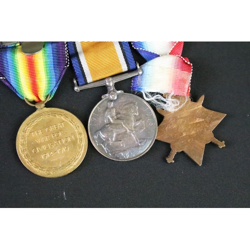 152 - First World War full size British Service medal trio to include 1914-1915 star, war medal and defenc... 