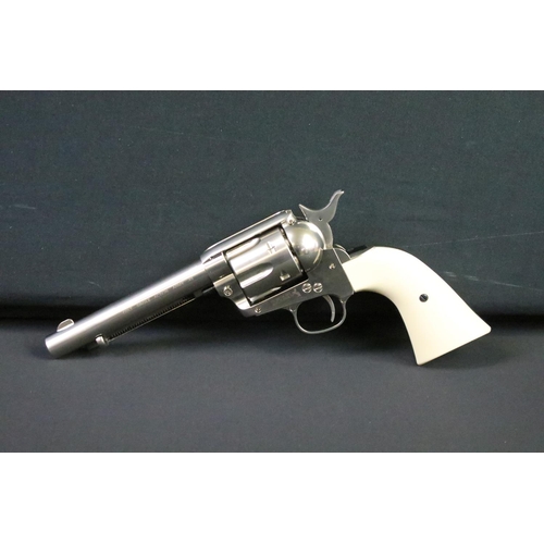 171 - A Colt 45 CO2 pellet air pistol together with CO2 cartridges.