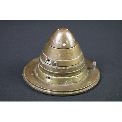 227 - A World War One trench art paper weight made from an artillery fuse and the base of an 18lb shell ca... 