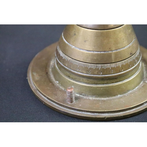 227 - A World War One trench art paper weight made from an artillery fuse and the base of an 18lb shell ca... 